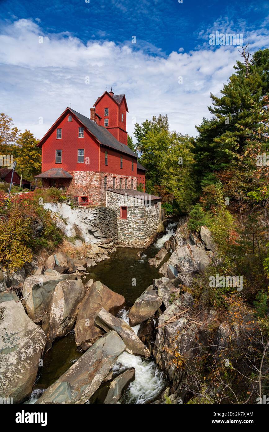 Side view of the Old Red Mill by the creek in Jericho Vermont during the fall Stock Photo