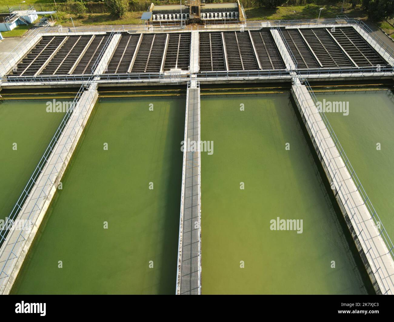 Water treatment facility with several filtration pools. Aerial drone