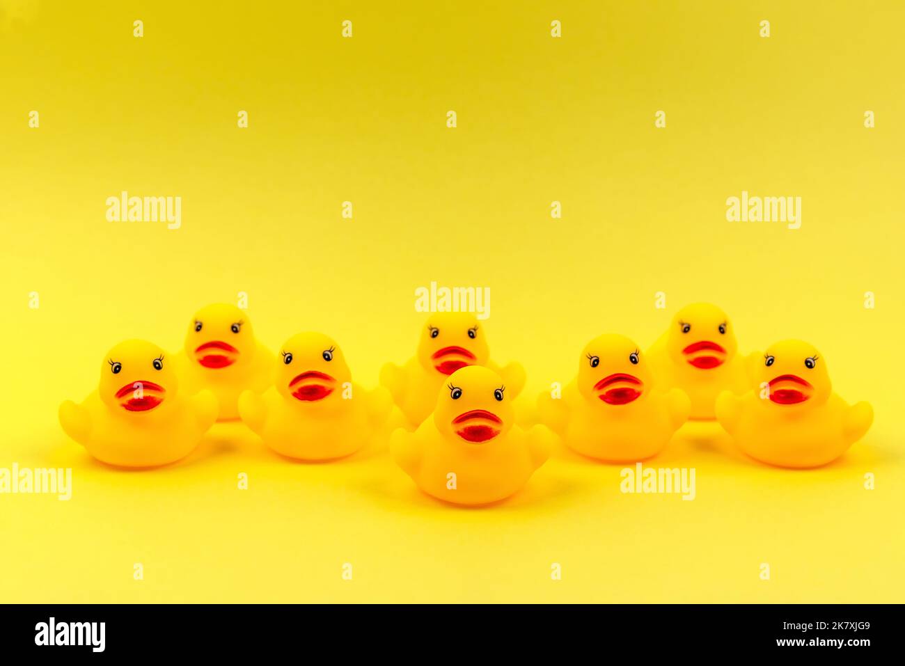 Rubber duck on a yellow background Stock Photo - Alamy