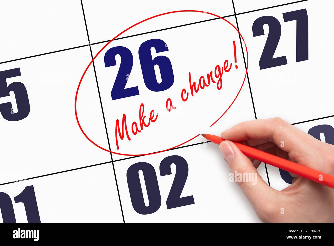 26th day of the month. Hand writing text MAKE A CHANGE and circling the ...