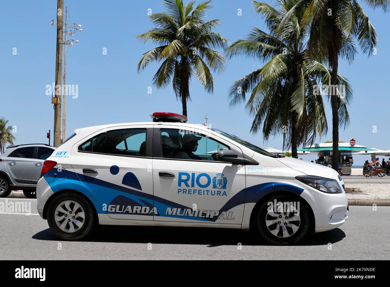 Police car vehicle of Rio de Janeiro Guarda Municipal squad patrolling street, traffic violations law enforcement Stock Photo