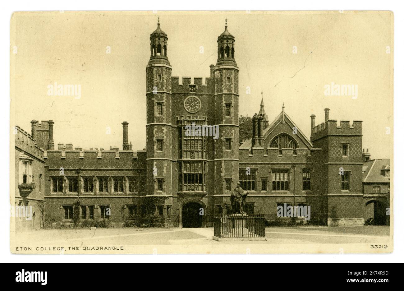 Original photochrom and sepia toned postcard of Eton College, an independent school with boarders. Prince William and Prince Harry, British Royals, attended this school. Postcard is of exterior showing the Quadrangle and clock tower, Lupton's Tower, School Yard, Twenty prime ministers were schooled at Eton College. Eton, Berkshire, England, U.K., circa 1910. Stock Photo