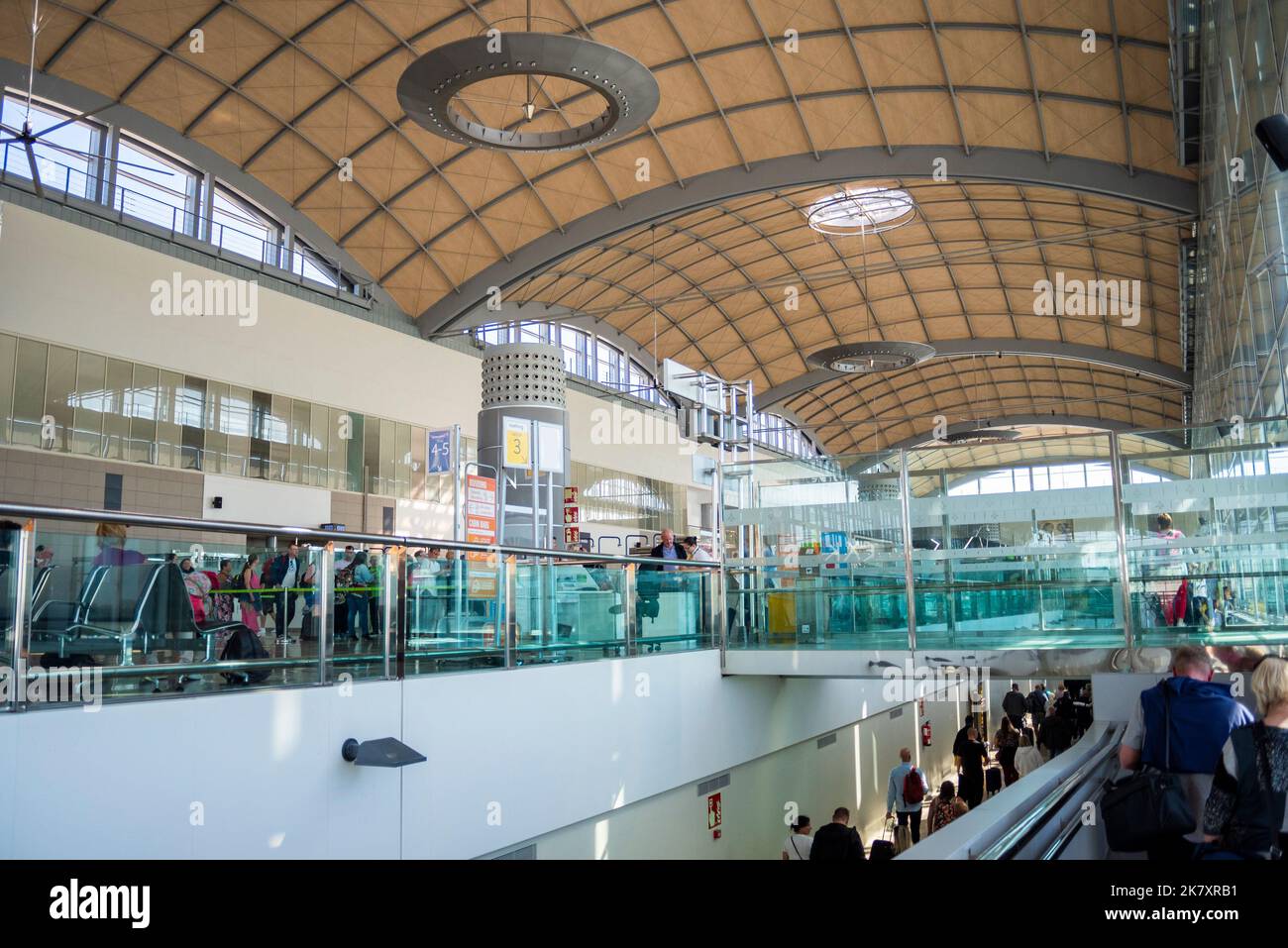 Structures inside Alicante Elche Miguel Hernández Airport terminal, Spain, Europe. Arched roof. Passenger arrivals below, departures above Stock Photo