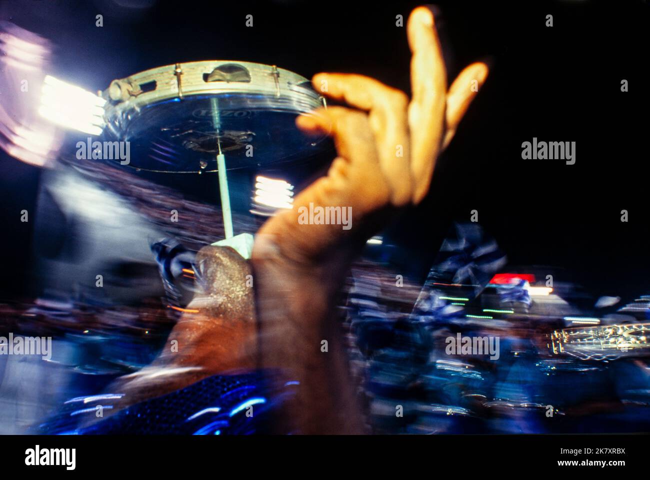 Rio de Janeiro Carnival, Samba Schools Parade, Brazil - Carnival dancers ( passistas ) playing percussion instrument pandeiro, a type of hand frame drum popular in Brazil, and which has been described as an unofficial instrument of that nation. The drumhead is tunable, and the rim holds metal jingles ( platinelas ). Stock Photo