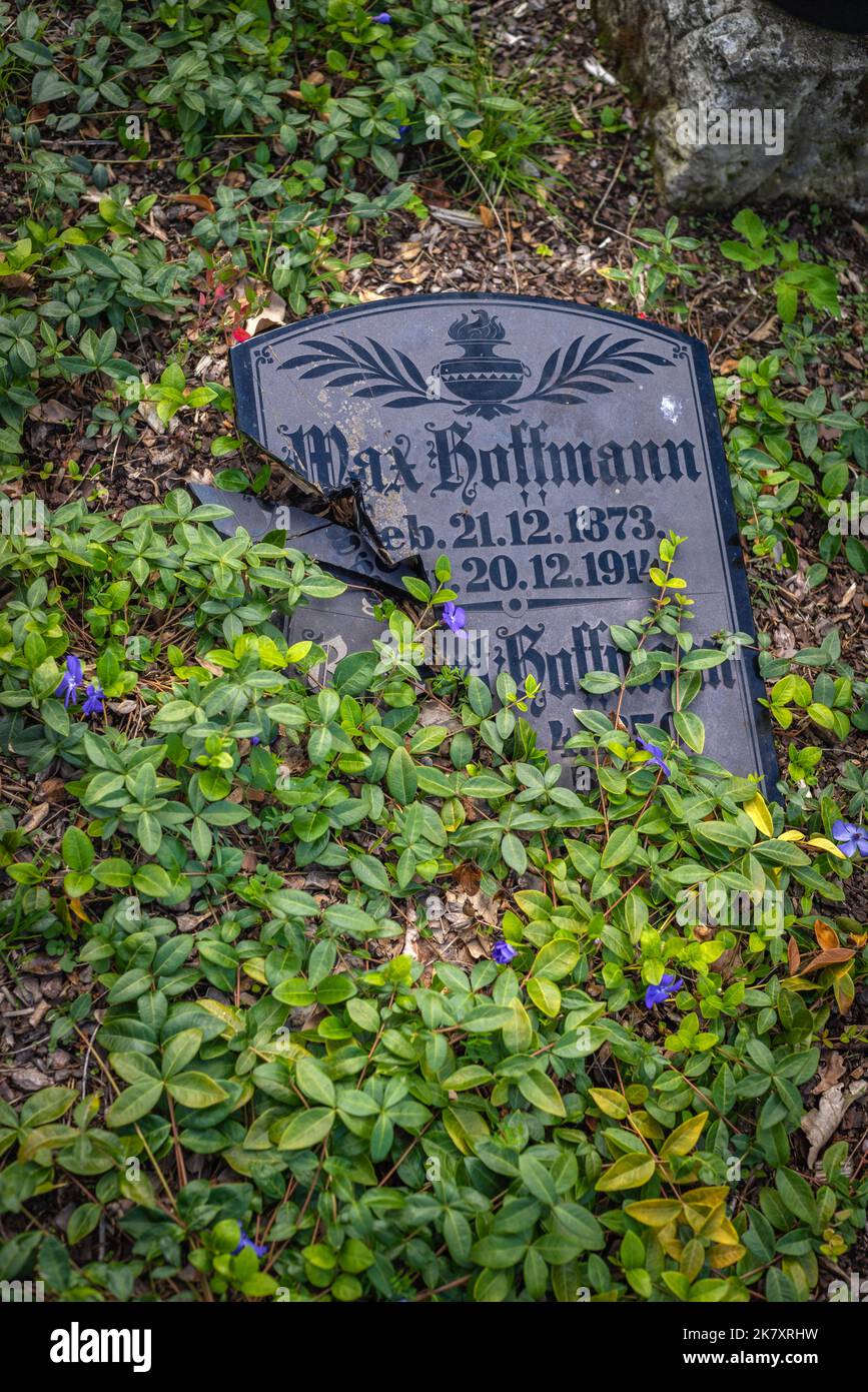 Damaged / broken gravestone tombstone on Friedhof Baumschulenweg in Berlin Treptow, Germany, Europe Stock Photo