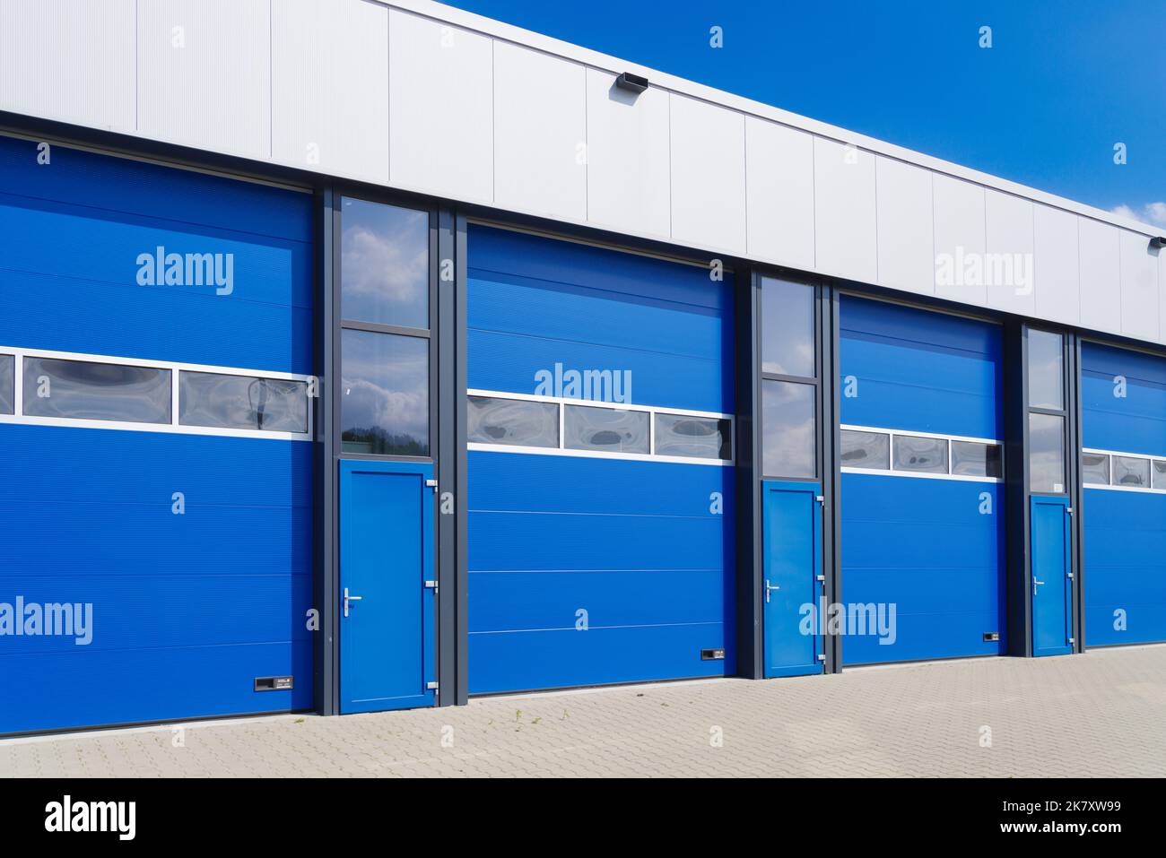 industrial unit with blue shutter doors Stock Photo