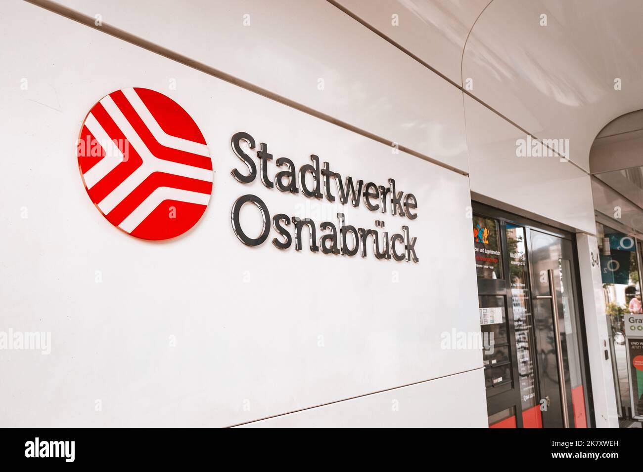 25 July 2022, Osnabruck, Germany: Utility company or Stadtwerke signage at the entrance of the building. Electricity, water supply and gas heating urb Stock Photo