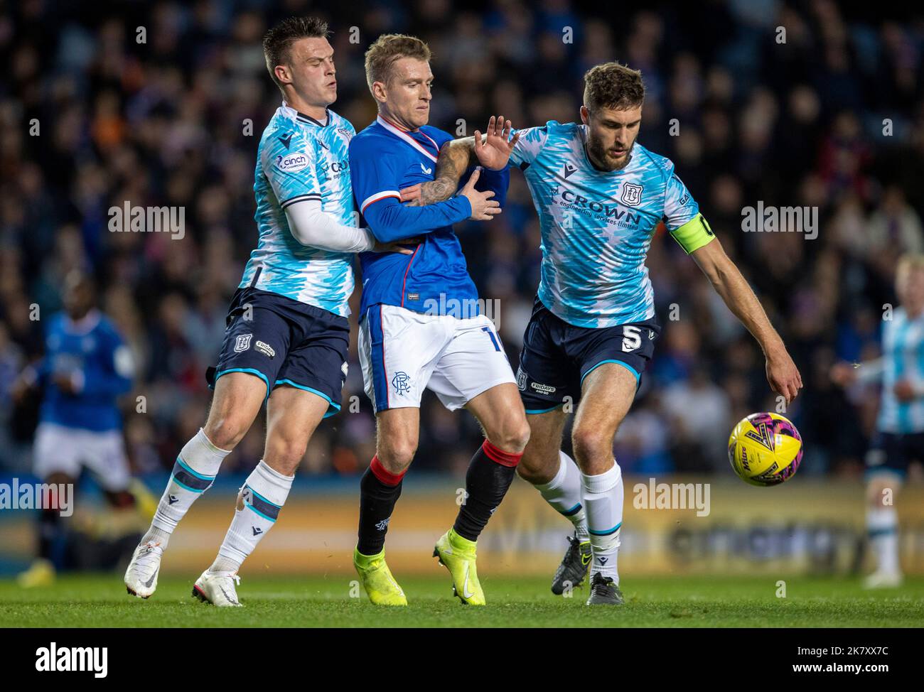 Rangers' Steven Davis (centre) with Dundee's Jordan Marshall (left) and