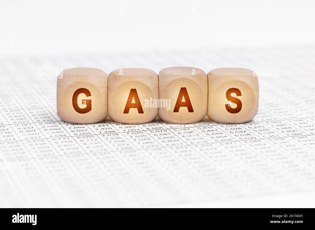 Business concept. On the table with documents are wooden cubes with the ...