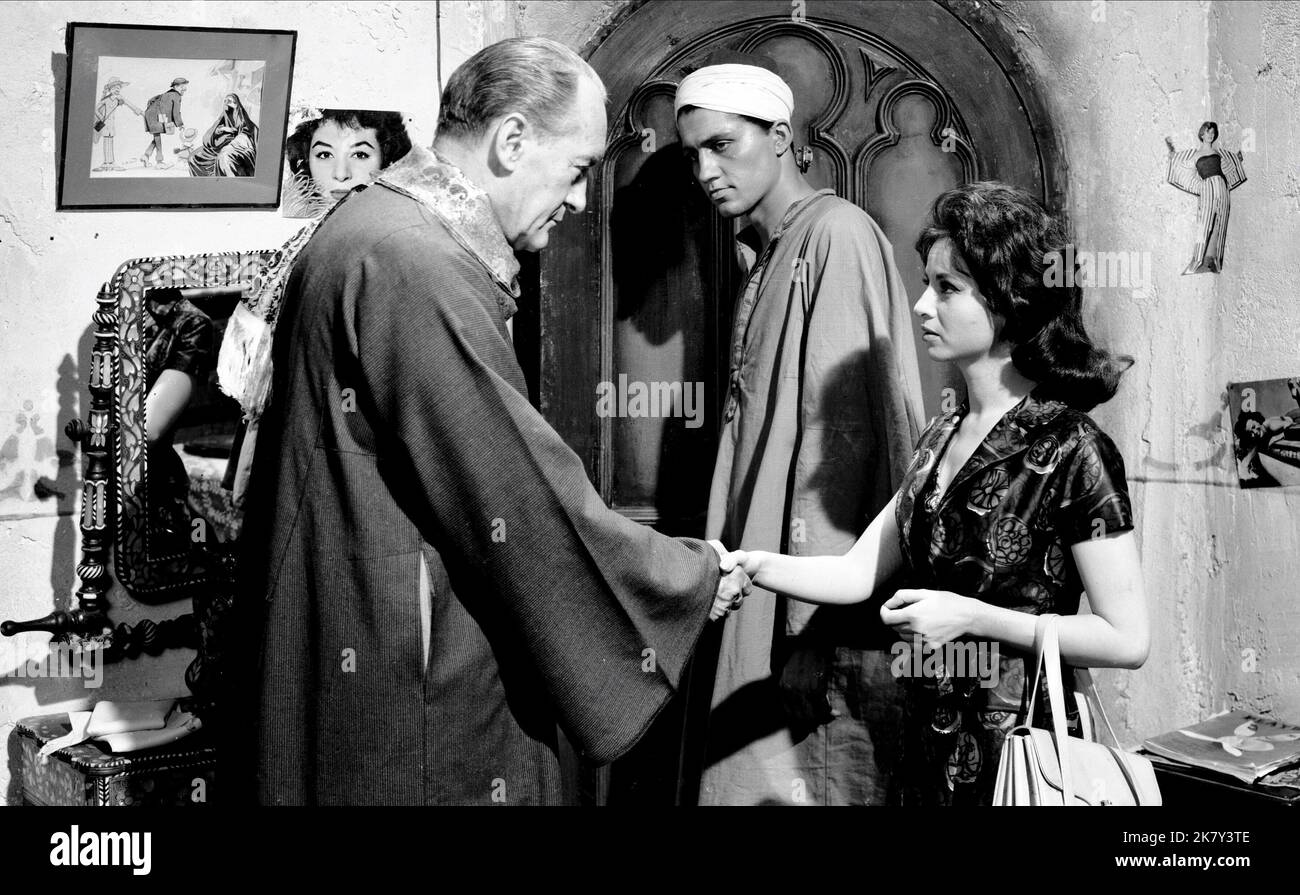 George Sanders & Faten Hamama  Film Cairo (1963) Characters: The Major, Amina  Director: Wolf Rilla 01 January 1963   **WARNING** This Photograph is for editorial use only and is the copyright of MGM and/or the Photographer assigned by the  Film or Production Company and can only be reproduced by publications in conjunction with the promotion of the above  Film. A Mandatory Credit To MGM is required. The Photographer should also be credited when known. No commercial use can be granted without written authority from the  Film Company. Stock Photo