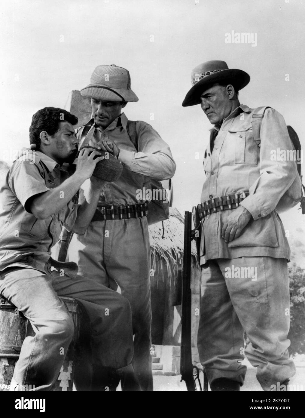 Frankie Avalon, Lloyd Bochner & Torin Thatcher Film: Drums Of Africa (1963) Characters: Brian Ferrers, David Moore, Jack Cuortemayn  Director: James B, Clark 15 May 1963   **WARNING** This Photograph is for editorial use only and is the copyright of MGM and/or the Photographer assigned by the Film or Production Company and can only be reproduced by publications in conjunction with the promotion of the above Film. A Mandatory Credit To MGM is required. The Photographer should also be credited when known. No commercial use can be granted without written authority from the Film Company. Stock Photo