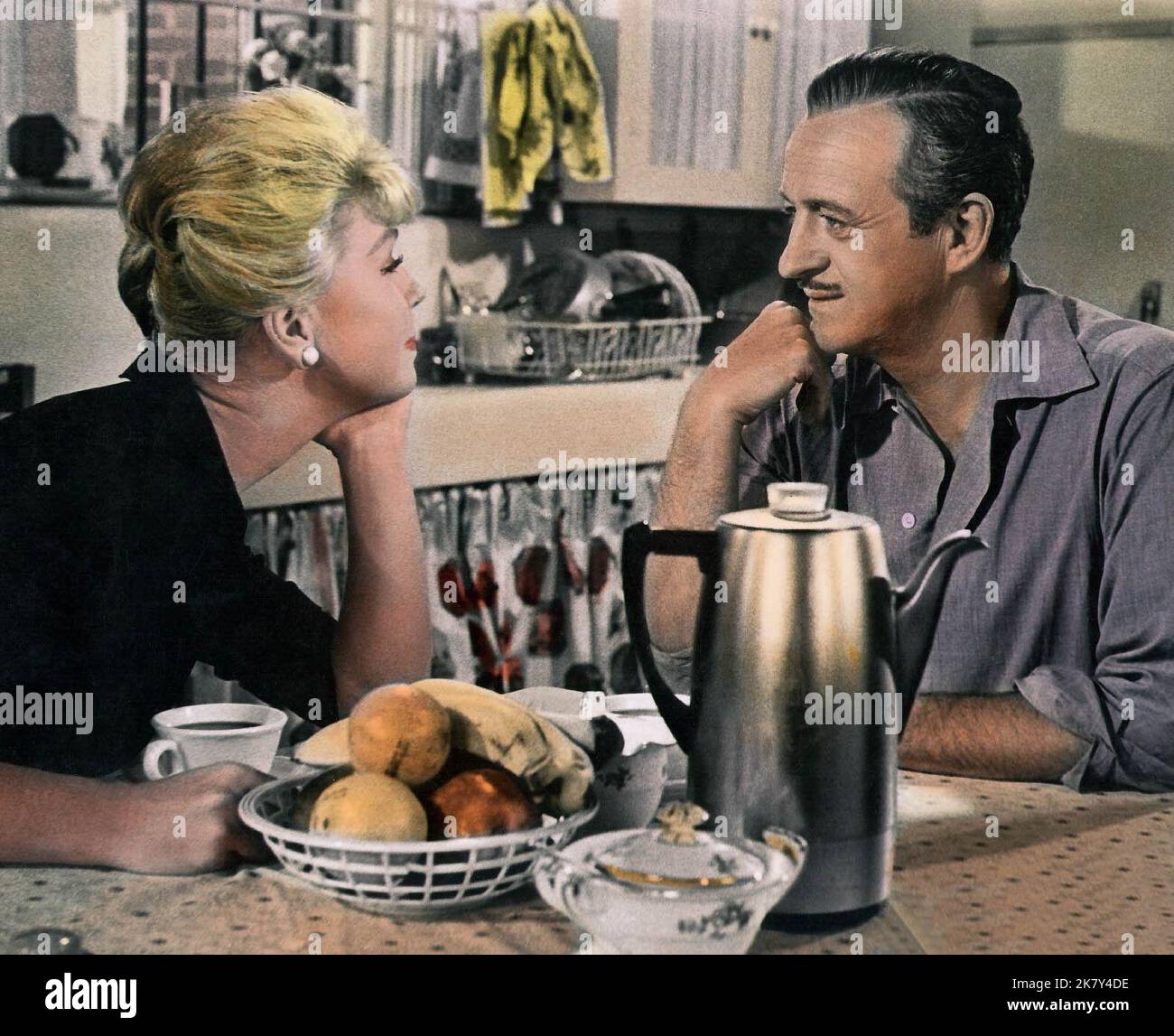 Doris Day & David Niven Film: Please Don'T Eat The Daisies (USA 1960) Characters: Kate Robinson Mackay & Lawrence Larry Mackay  Director: Charles Walters 31 March 1960   **WARNING** This Photograph is for editorial use only and is the copyright of MGM and/or the Photographer assigned by the Film or Production Company and can only be reproduced by publications in conjunction with the promotion of the above Film. A Mandatory Credit To MGM is required. The Photographer should also be credited when known. No commercial use can be granted without written authority from the Film Company. Stock Photo