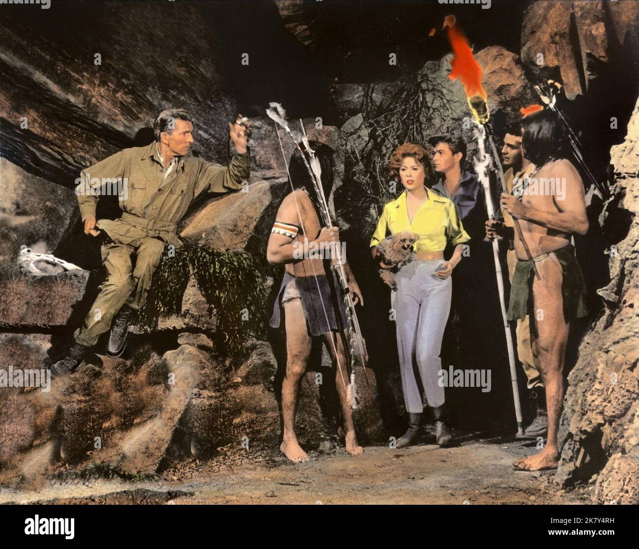 Michael Rennie, Jill St. John, Ray Stricklyn & David Hedison Film: The Lost World (USA 1960) Characters: Lord John Roxton,Jennifer Holmes (as Jill St.John),David Holmes & Ed Malone  / Titel Auch: 'Urupara - Die Versunkene Welt' Director: Irwin Allen 13 July 1960   **WARNING** This Photograph is for editorial use only and is the copyright of IRWIN ALLEN PRODUCTIONS and/or the Photographer assigned by the Film or Production Company and can only be reproduced by publications in conjunction with the promotion of the above Film. A Mandatory Credit To IRWIN ALLEN PRODUCTIONS is required. The Photogr Stock Photo