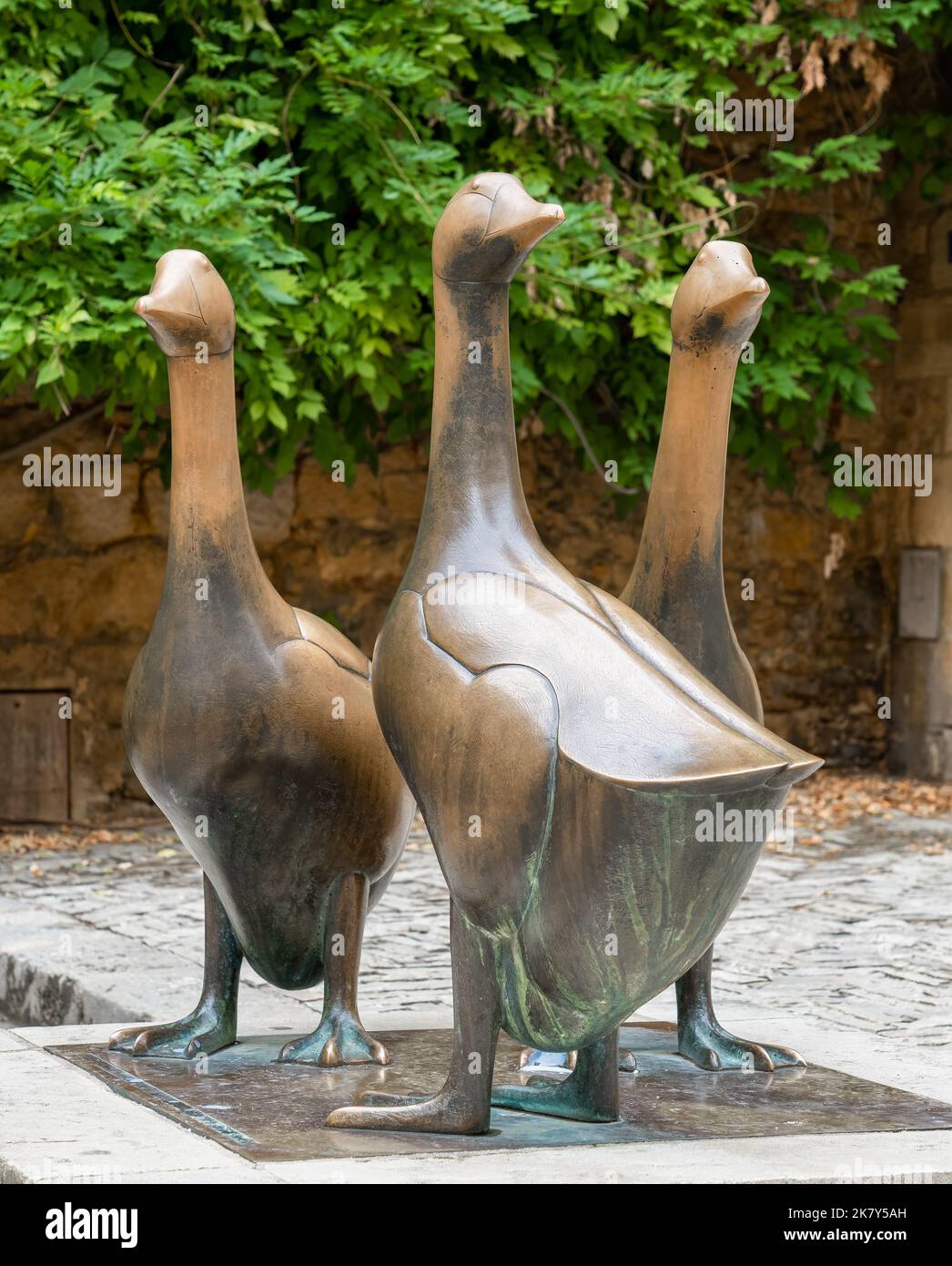 three bronze geese statues, emblems of the duck, geese and foie gras