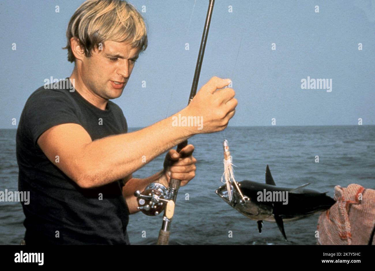 David Mccallum Catches Fish Film: The Heroin Gang (1968)   Director: Brian G. Hutton 07 February 1968   **WARNING** This Photograph is for editorial use only and is the copyright of MGM and/or the Photographer assigned by the Film or Production Company and can only be reproduced by publications in conjunction with the promotion of the above Film. A Mandatory Credit To MGM is required. The Photographer should also be credited when known. No commercial use can be granted without written authority from the Film Company. Stock Photo
