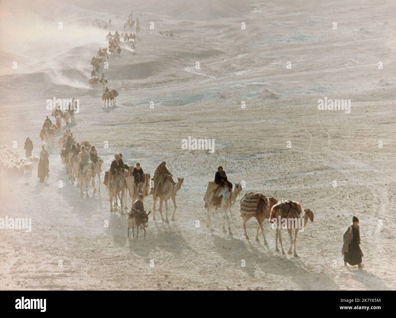 Camels Cross Desert Film: The Bible: In The Beginning...; La Bibbia (USA/IT 1966)   Director: John Huston 28 September 1966   **WARNING** This Photograph is for editorial use only and is the copyright of 20TH CENTURY FOX and/or the Photographer assigned by the Film or Production Company and can only be reproduced by publications in conjunction with the promotion of the above Film. A Mandatory Credit To 20TH CENTURY FOX is required. The Photographer should also be credited when known. No commercial use can be granted without written authority from the Film Company. Stock Photo