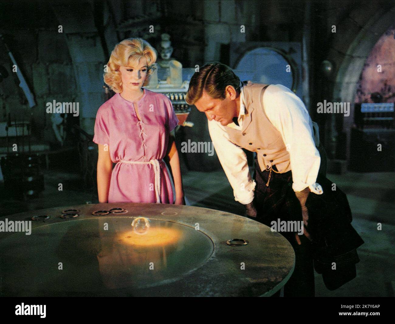 Yvette Mimieux & Rod Taylor Film: The Time Machine (USA 1960) Characters: Weena & H. George Wells  Director: George Pal 17 August 1960   **WARNING** This Photograph is for editorial use only and is the copyright of MGM and/or the Photographer assigned by the Film or Production Company and can only be reproduced by publications in conjunction with the promotion of the above Film. A Mandatory Credit To MGM is required. The Photographer should also be credited when known. No commercial use can be granted without written authority from the Film Company. Stock Photo