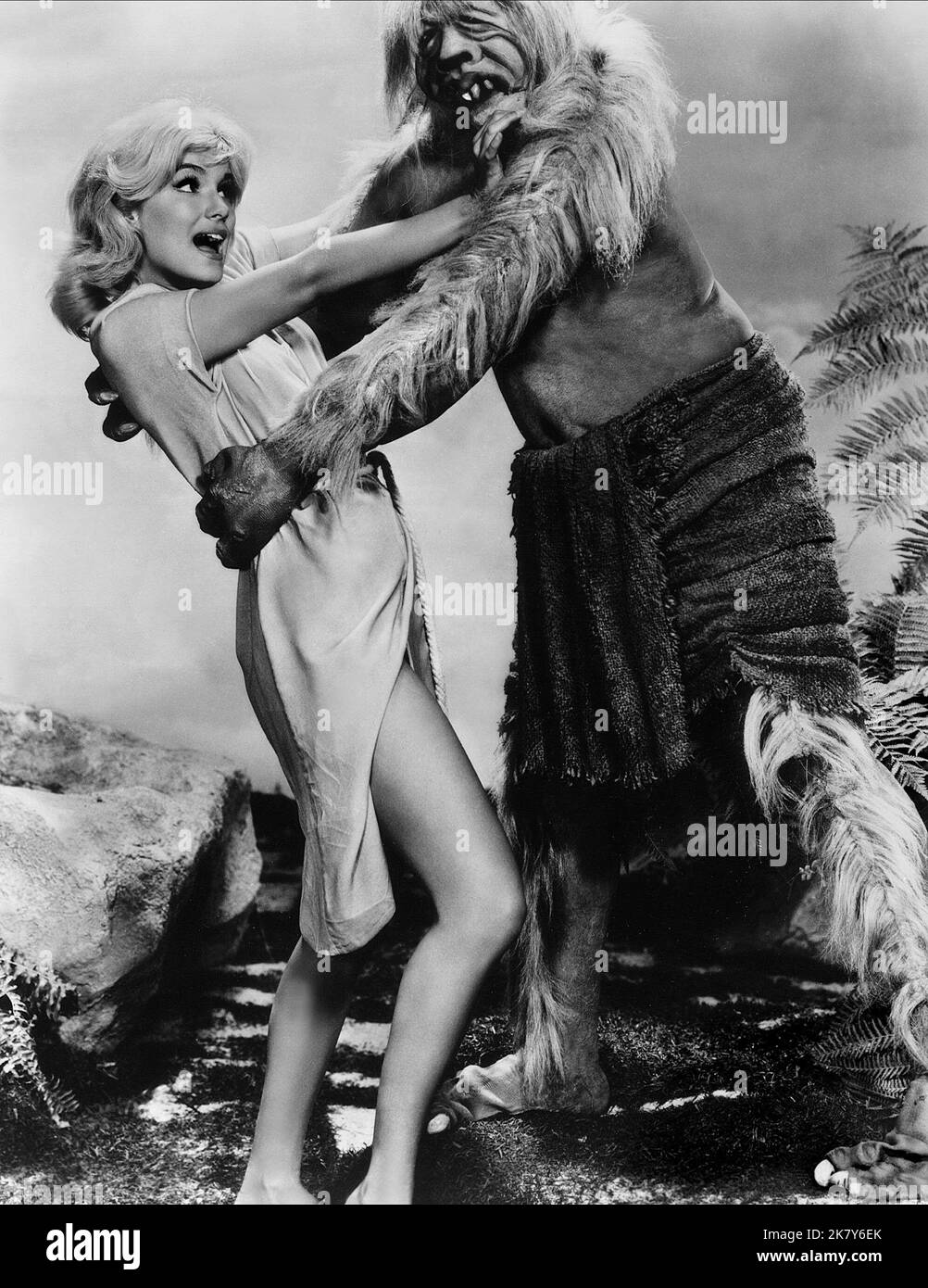 Yvette Mimieux & Monster Film: The Time Machine (USA 1960) Characters: Weena &  Director: George Pal 17 August 1960   **WARNING** This Photograph is for editorial use only and is the copyright of MGM and/or the Photographer assigned by the Film or Production Company and can only be reproduced by publications in conjunction with the promotion of the above Film. A Mandatory Credit To MGM is required. The Photographer should also be credited when known. No commercial use can be granted without written authority from the Film Company. Stock Photo