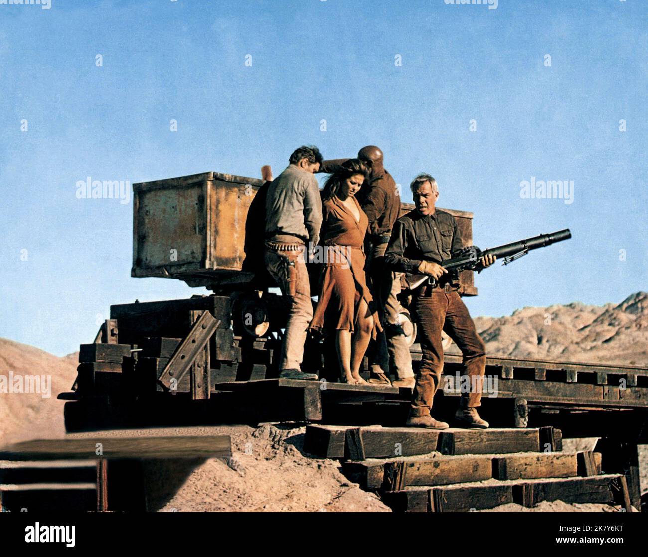 Burt Lancaster, Claudia Cardinale, Woody Strode & Lee Marvin Film: The Professionals (USA 1966) Characters: Bill Dolworth,Mrs. Maria Grant,Jake Sharp & Henry 'Rico' Fardan  Director: Richard Brooks 02 November 1966   **WARNING** This Photograph is for editorial use only and is the copyright of COLUMBIA and/or the Photographer assigned by the Film or Production Company and can only be reproduced by publications in conjunction with the promotion of the above Film. A Mandatory Credit To COLUMBIA is required. The Photographer should also be credited when known. No commercial use can be granted wit Stock Photo