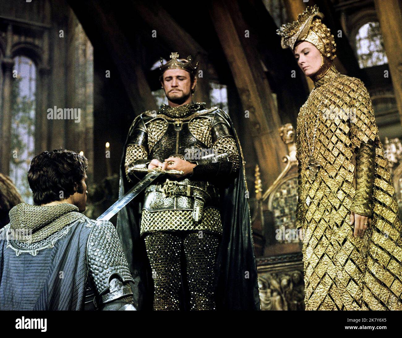 Franco Nero & Richard Harris & Vanessa Redgrave Film: Camelot (1967) Characters: Lancelot Du Lac & King Arthur & Guenevere  Director: Joshua Logan 25 October 1967   **WARNING** This Photograph is for editorial use only and is the copyright of WARNER BROS and/or the Photographer assigned by the Film or Production Company and can only be reproduced by publications in conjunction with the promotion of the above Film. A Mandatory Credit To WARNER BROS is required. The Photographer should also be credited when known. No commercial use can be granted without written authority from the Film Company. Stock Photo