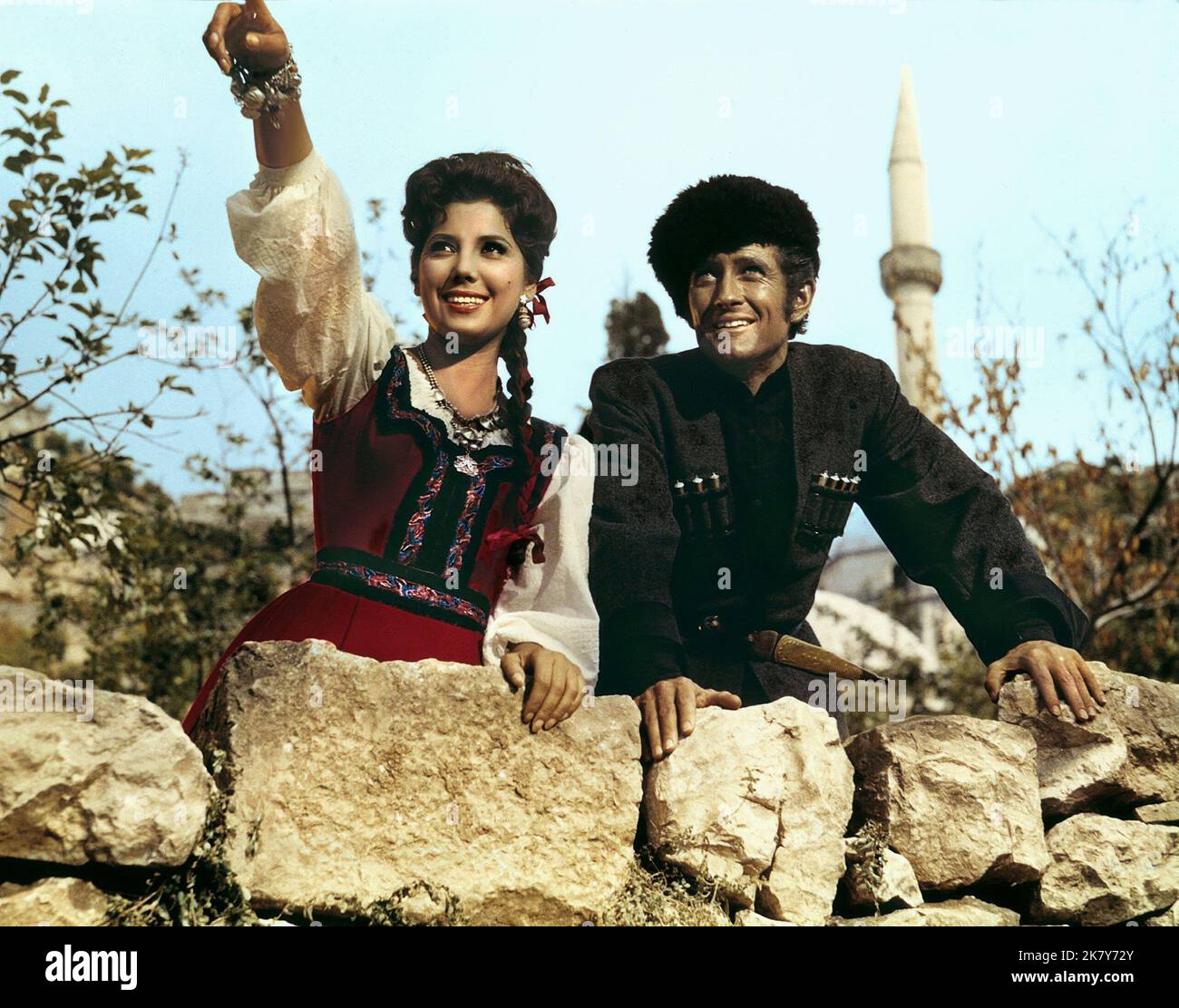 Maria Grazia Spina, John Drew Barrymore Film: The Cossacks (1962) Characters: Alina,Giamal  Director: Giorgio Rivalta 04 May 1960   **WARNING** This Photograph is for editorial use only and is the copyright of UNIVERSAL and/or the Photographer assigned by the Film or Production Company and can only be reproduced by publications in conjunction with the promotion of the above Film. A Mandatory Credit To UNIVERSAL is required. The Photographer should also be credited when known. No commercial use can be granted without written authority from the Film Company. Stock Photo