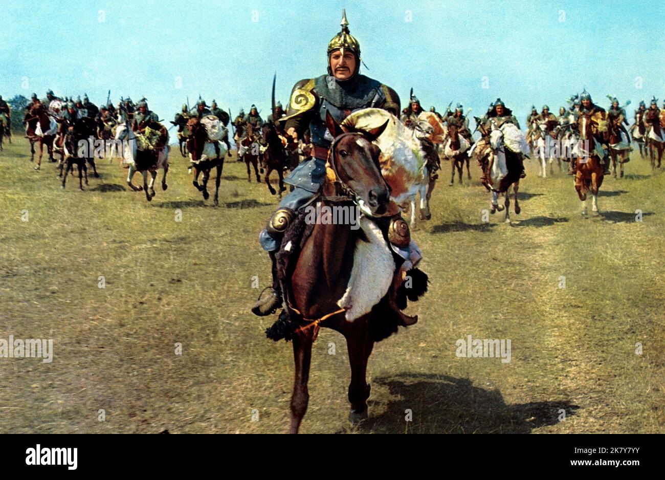 Telly Savalas In Battle Scene Film: Genghis Khan (USA/UKDE/YUG 1965)   Director: Henry Levin 15 April 1965   **WARNING** This Photograph is for editorial use only and is the copyright of COLUMBIA PICTURES and/or the Photographer assigned by the Film or Production Company and can only be reproduced by publications in conjunction with the promotion of the above Film. A Mandatory Credit To COLUMBIA PICTURES is required. The Photographer should also be credited when known. No commercial use can be granted without written authority from the Film Company. Stock Photo