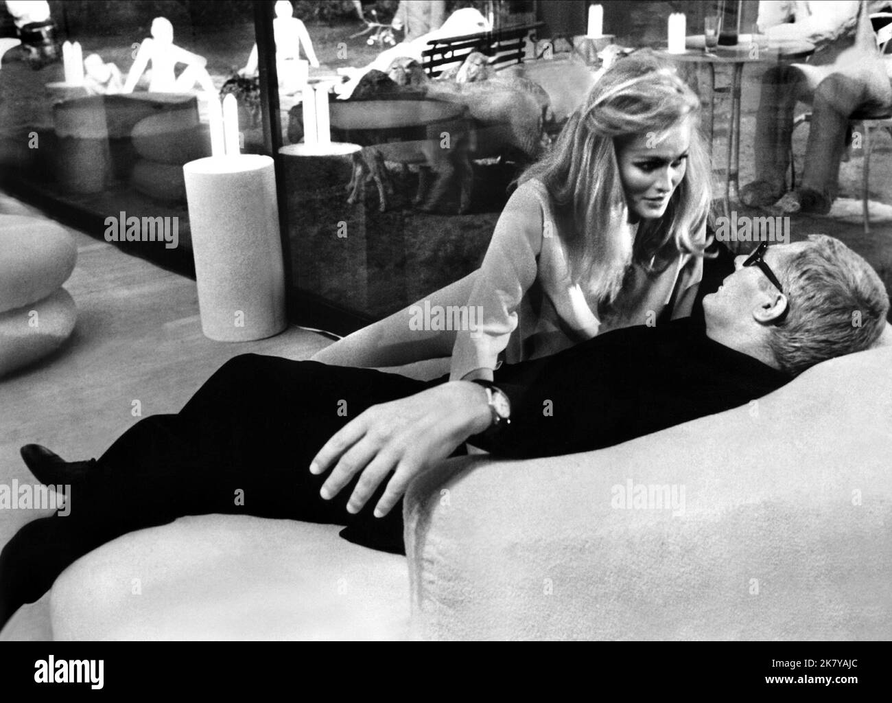 Ursula Andress & Marcello Mastroianni Film: The Tenth Victim: La Decima Vittima (1965) Characters: Caroline Meredith, Marcello Polletti  Director: Elio Petri 01 December 1965   **WARNING** This Photograph is for editorial use only and is the copyright of LES FILMS and/or the Photographer assigned by the Film or Production Company and can only be reproduced by publications in conjunction with the promotion of the above Film. A Mandatory Credit To LES FILMS is required. The Photographer should also be credited when known. No commercial use can be granted without written authority from the Film C Stock Photo