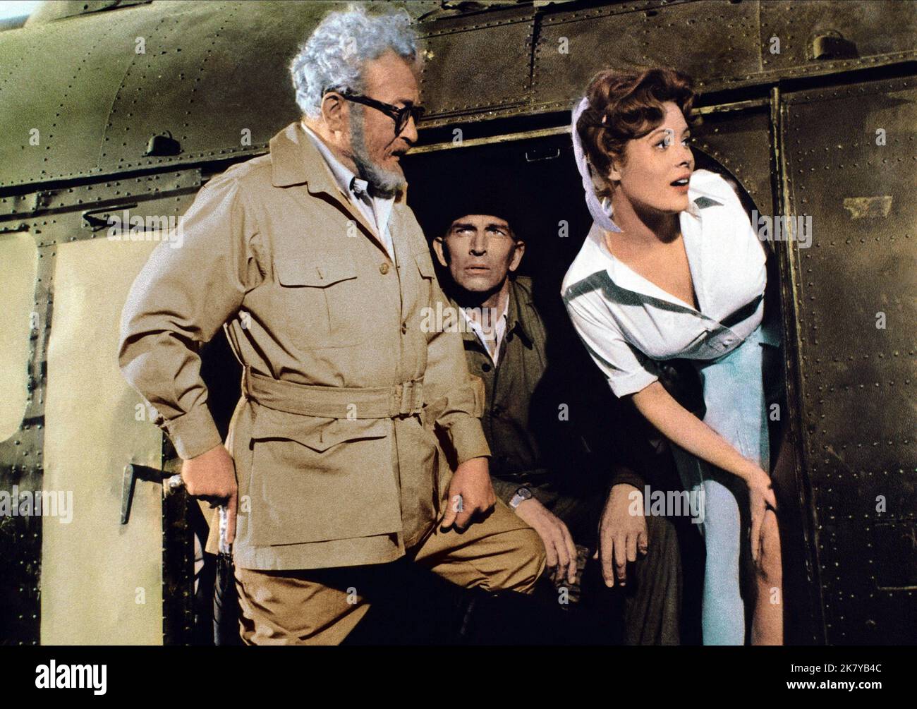 Claude Rains, Michael Rennie & Jill St. John Film: The Lost World (USA 1960) Characters: Professor George Edward Challenger, Lord John Roxton, Jennifer Holmes (as Jill St.John)  / Titel Auch: 'Urupara - Die Versunkene Welt' Director: Irwin Allen 13 July 1960   **WARNING** This Photograph is for editorial use only and is the copyright of IRWIN ALLEN PRODUCTIONS and/or the Photographer assigned by the Film or Production Company and can only be reproduced by publications in conjunction with the promotion of the above Film. A Mandatory Credit To IRWIN ALLEN PRODUCTIONS is required. The Photographe Stock Photo