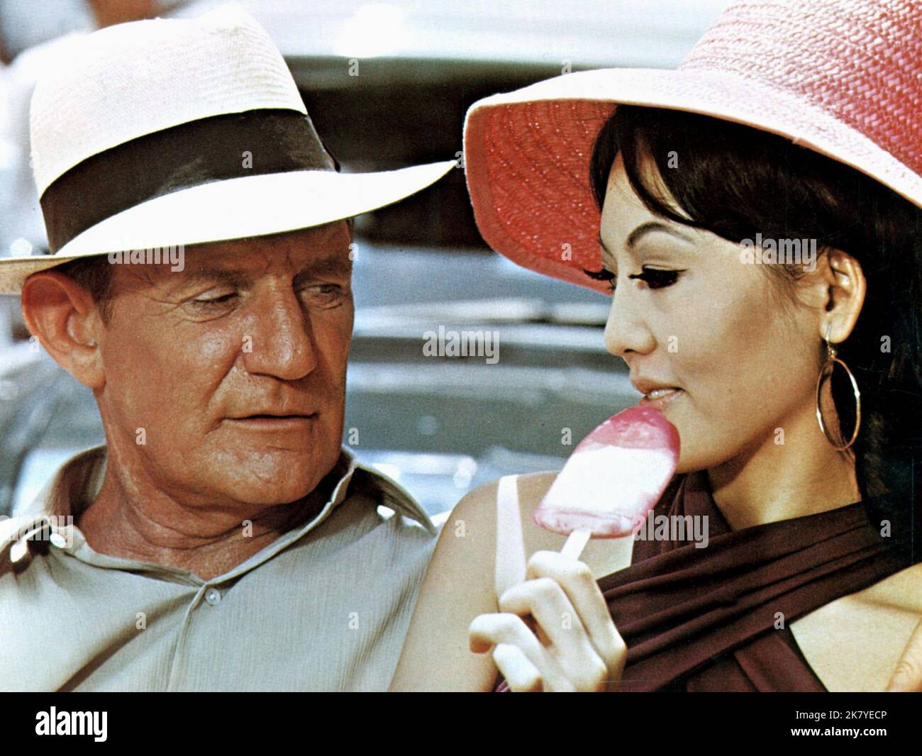 Trevor Howard & Kalen Liu Film: Pretty Polly (1967) Characters: Robert Hook & Lorelei  Director: Guy Green 19 October 1967   **WARNING** This Photograph is for editorial use only and is the copyright of UNIVERSAL and/or the Photographer assigned by the Film or Production Company and can only be reproduced by publications in conjunction with the promotion of the above Film. A Mandatory Credit To UNIVERSAL is required. The Photographer should also be credited when known. No commercial use can be granted without written authority from the Film Company. Stock Photo