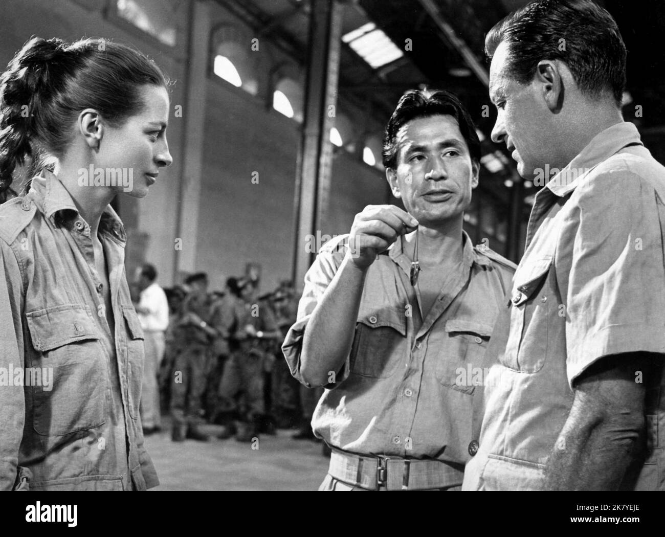 Capucine, Tetsuro Tamba & William Holden Film: The 7th Dawn (1964) Characters: Dhana Mercier,Ng & Major Ferris  Director: Lewis Gilbert 02 September 1964   **WARNING** This Photograph is for editorial use only and is the copyright of UNITED ARTISTS and/or the Photographer assigned by the Film or Production Company and can only be reproduced by publications in conjunction with the promotion of the above Film. A Mandatory Credit To UNITED ARTISTS is required. The Photographer should also be credited when known. No commercial use can be granted without written authority from the Film Company. Stock Photo