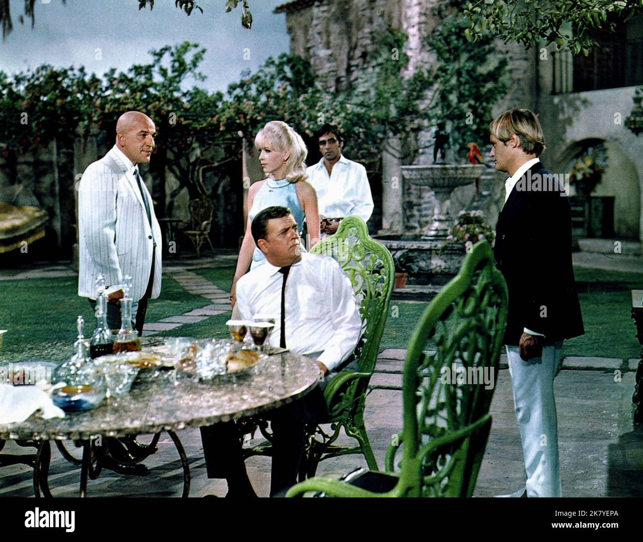 Telly Savalas, Stella Stevens, Pat Hingle & David Mccallum Film: The Heroin Gang (1967) Characters: Emil Dietrich,Stacey Woodward,Harry Mitchell & Sol Madrid  Director: Brian G Hutton 07 February 1968   **WARNING** This Photograph is for editorial use only and is the copyright of MGM and/or the Photographer assigned by the Film or Production Company and can only be reproduced by publications in conjunction with the promotion of the above Film. A Mandatory Credit To MGM is required. The Photographer should also be credited when known. No commercial use can be granted without written authority f Stock Photo