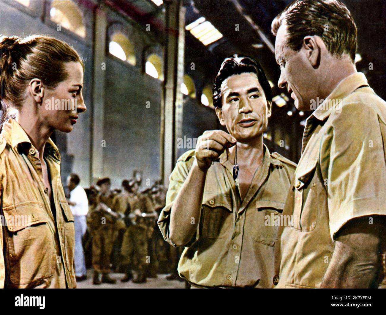 Capucine, Tetsuro Tamba & William Holden Film: The 7th Dawn (1964) Characters: Dhana Mercier,Ng & Major Ferris  Director: Lewis Gilbert 02 September 1964   **WARNING** This Photograph is for editorial use only and is the copyright of UNITED ARTISTS and/or the Photographer assigned by the Film or Production Company and can only be reproduced by publications in conjunction with the promotion of the above Film. A Mandatory Credit To UNITED ARTISTS is required. The Photographer should also be credited when known. No commercial use can be granted without written authority from the Film Company. Stock Photo