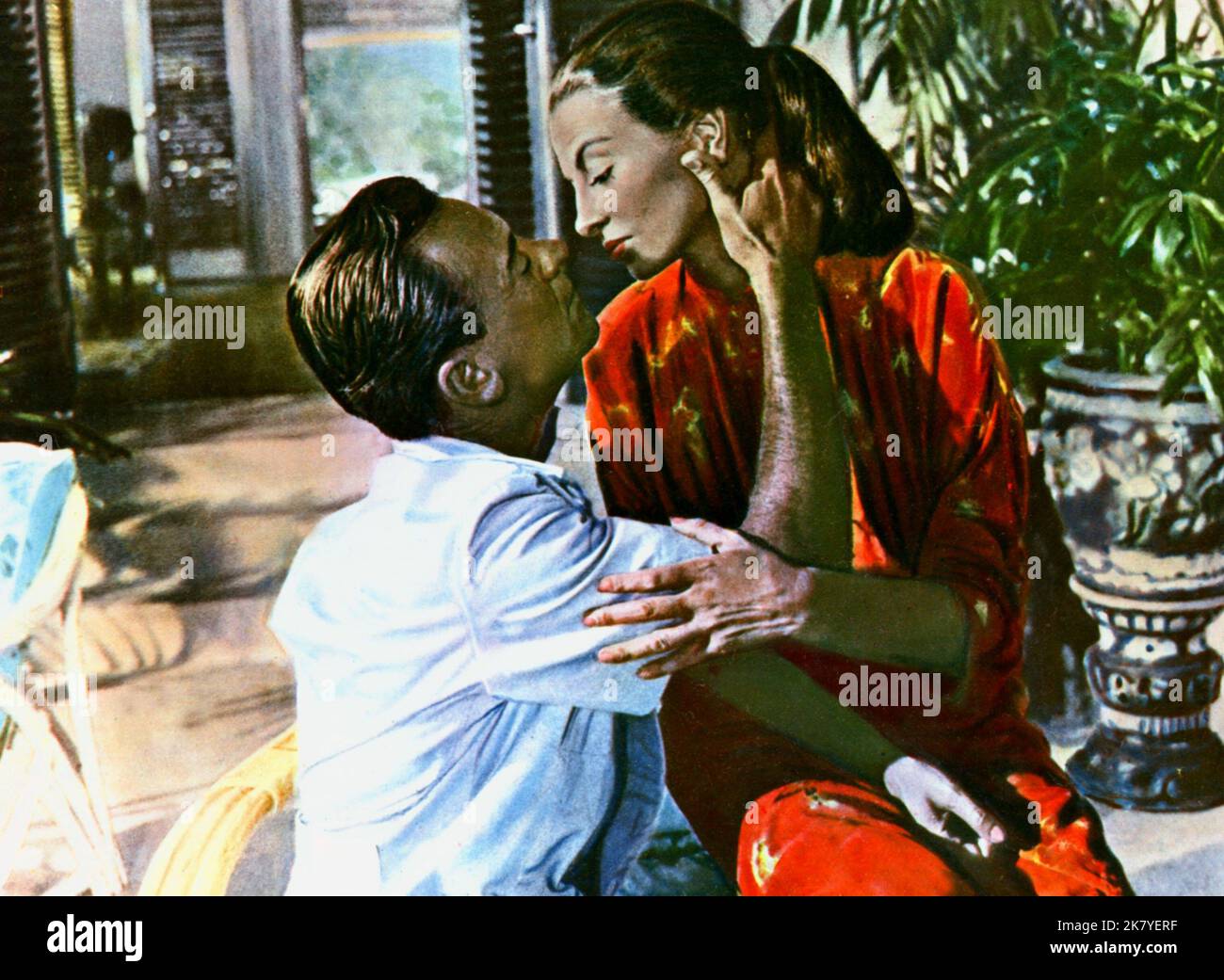 William Holden & Capucine Film: The 7th Dawn (1964) Characters: Major Ferris & Dhana Mercier  Director: Lewis Gilbert 02 September 1964   **WARNING** This Photograph is for editorial use only and is the copyright of UNITED ARTISTS and/or the Photographer assigned by the Film or Production Company and can only be reproduced by publications in conjunction with the promotion of the above Film. A Mandatory Credit To UNITED ARTISTS is required. The Photographer should also be credited when known. No commercial use can be granted without written authority from the Film Company. Stock Photo