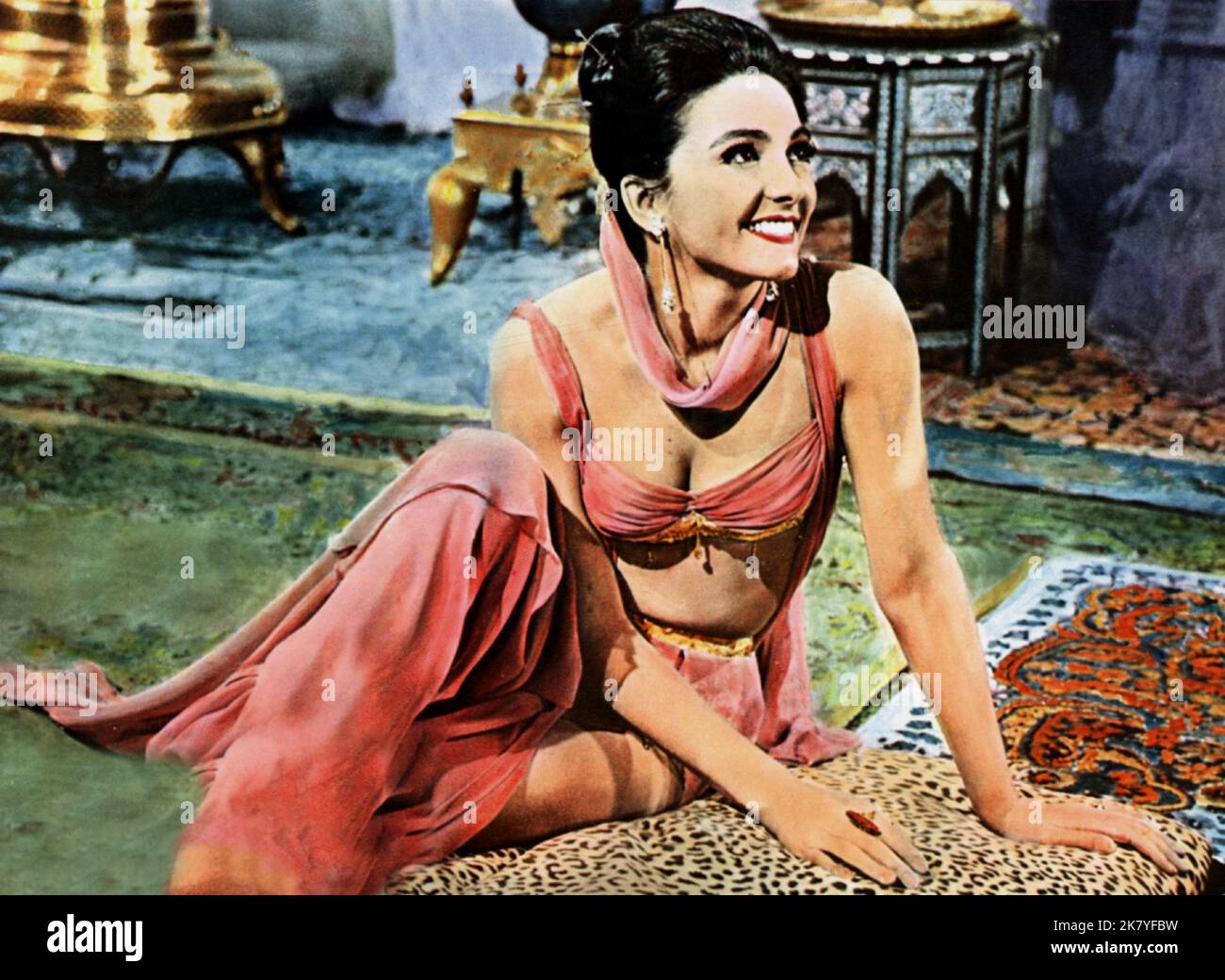 Kamala Devi Film: The Brass Bottle (1964) Characters: Tezra  Director: Harry Keller 20 May 1964   **WARNING** This Photograph is for editorial use only and is the copyright of UNIVERSAL PICTURES and/or the Photographer assigned by the Film or Production Company and can only be reproduced by publications in conjunction with the promotion of the above Film. A Mandatory Credit To UNIVERSAL PICTURES is required. The Photographer should also be credited when known. No commercial use can be granted without written authority from the Film Company. Stock Photo
