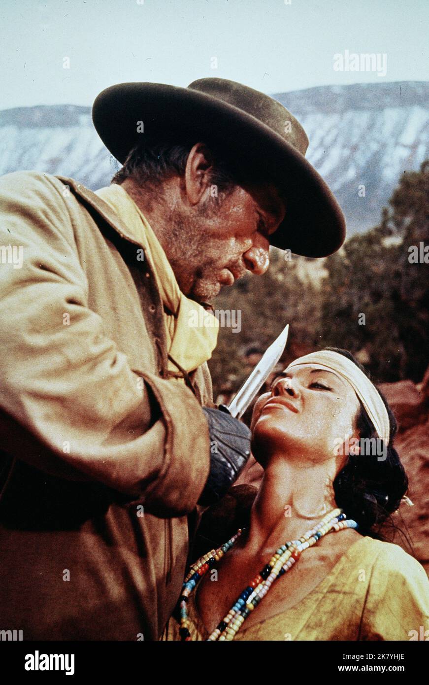 Richard Boone & Wende Wagner Film: Rio Conchos (1964) Characters: Maj. James 'Jim' Lassiter & Sally (Apache girl)  Director: Gordon Douglas 28 October 1964   **WARNING** This Photograph is for editorial use only and is the copyright of 20 CENTURY FOX and/or the Photographer assigned by the Film or Production Company and can only be reproduced by publications in conjunction with the promotion of the above Film. A Mandatory Credit To 20 CENTURY FOX is required. The Photographer should also be credited when known. No commercial use can be granted without written authority from the Film Company. Stock Photo