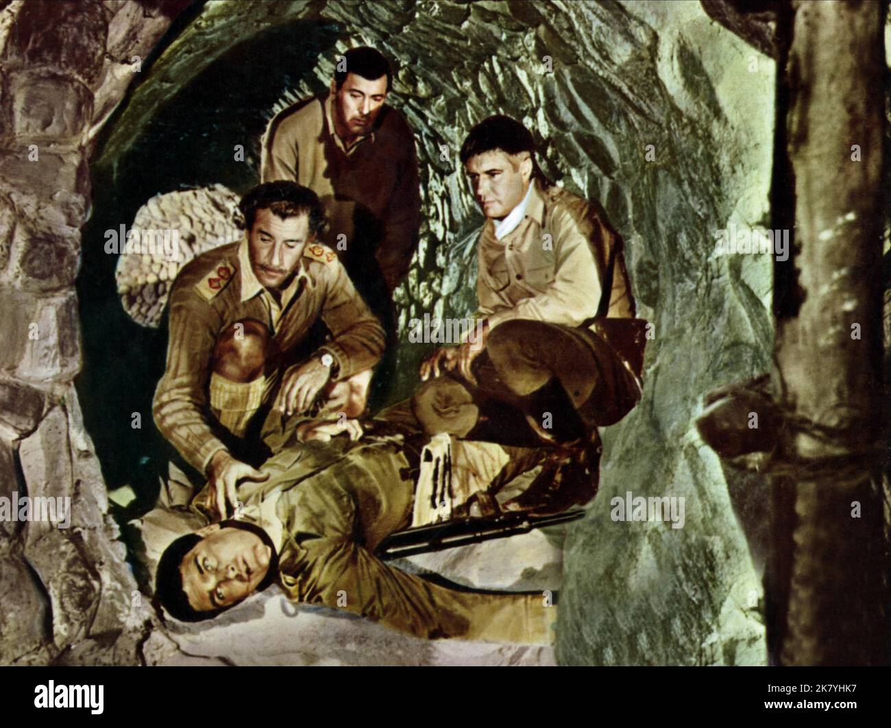 Nigel Green, Rock Hudson, Guy Stockwell & Robert Wolders Film: Tobruk (1967) Characters: Col. John Harker,Maj. Donald Craig,Lt. Max Mohnfeld & Corporal Bruckner  Director: Arthur Hiller 07 February 1967   **WARNING** This Photograph is for editorial use only and is the copyright of UNIVERSAL and/or the Photographer assigned by the Film or Production Company and can only be reproduced by publications in conjunction with the promotion of the above Film. A Mandatory Credit To UNIVERSAL is required. The Photographer should also be credited when known. No commercial use can be granted without writt Stock Photo