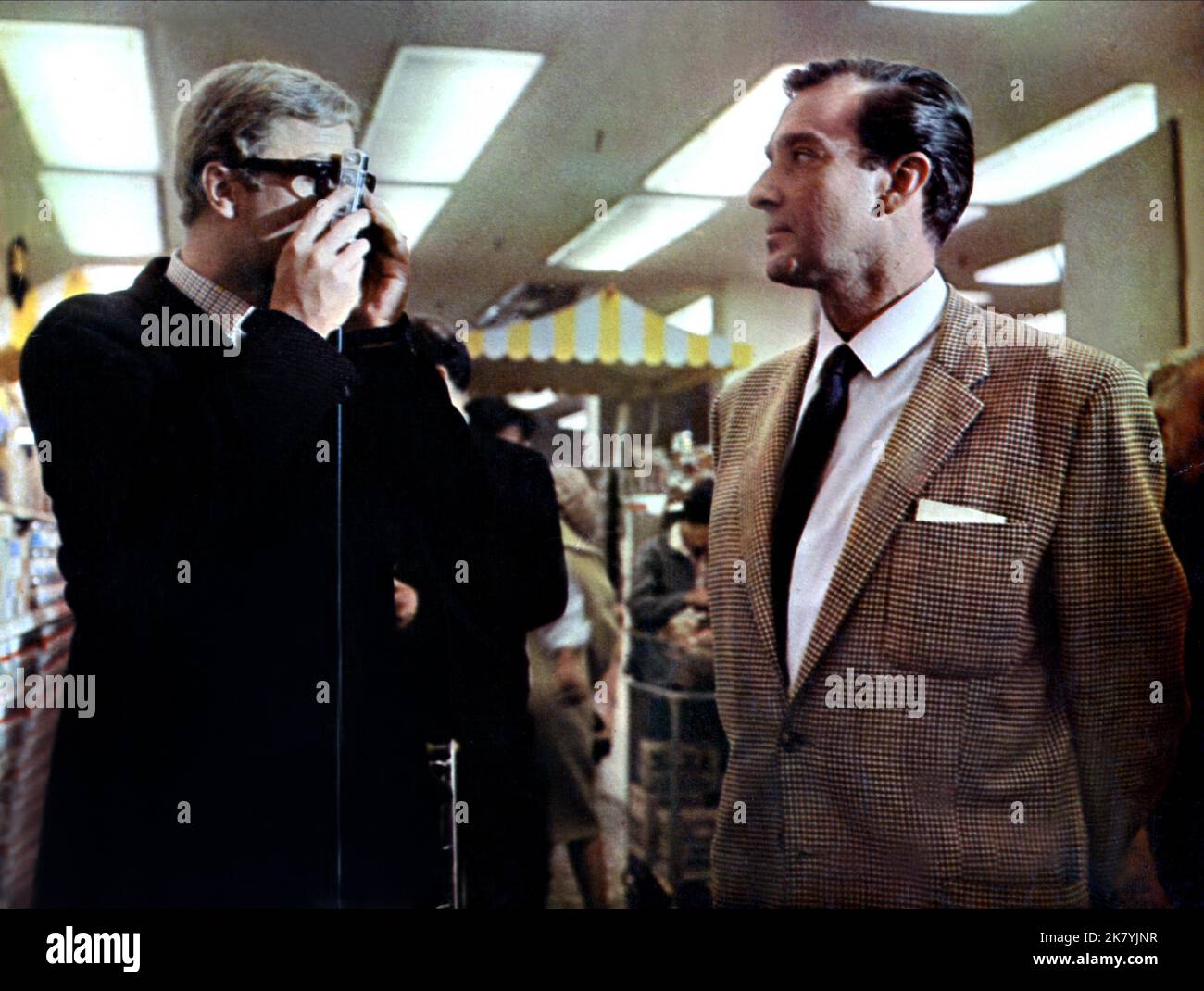 Michael Caine & Guy Doleman Film: The Ipcress File (1966) Characters: Harry Palmer & Colonel Ross  Director: Sidney J. Furie 02 July 1965   **WARNING** This Photograph is for editorial use only and is the copyright of RANK and/or the Photographer assigned by the Film or Production Company and can only be reproduced by publications in conjunction with the promotion of the above Film. A Mandatory Credit To RANK is required. The Photographer should also be credited when known. No commercial use can be granted without written authority from the Film Company. Stock Photo