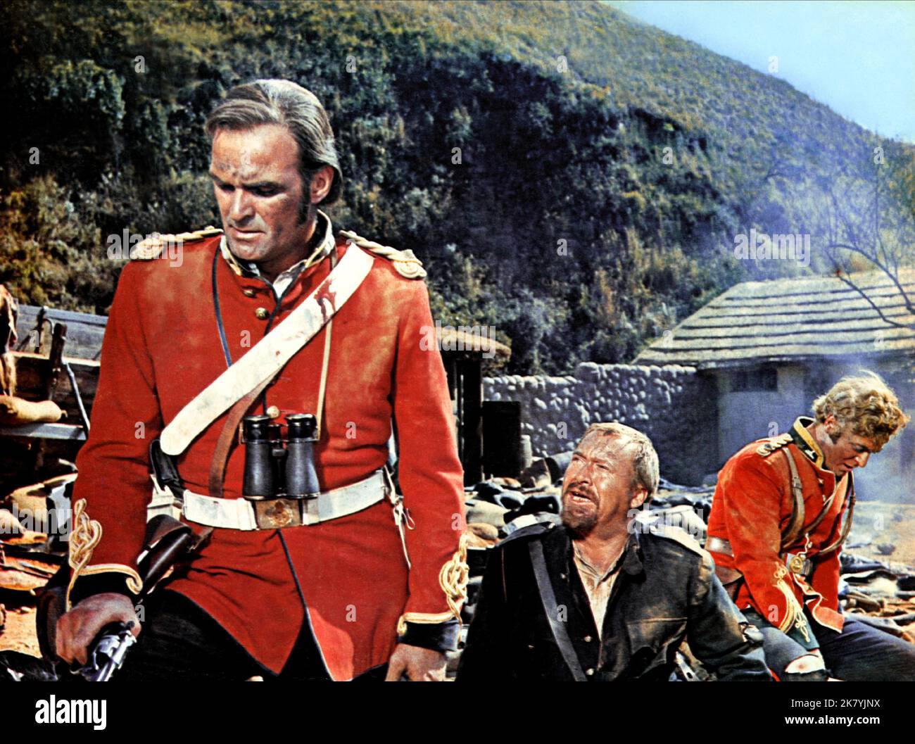 Stanley Baker, Gert Van Den Bergh & Michael Caine Film: Zulu (1966) Characters: Lieutenant John Chard R.E.,Adendorff & Lieutenant Gonville Bromhead  Director: Cy Endfield 22 January 1964   **WARNING** This Photograph is for editorial use only and is the copyright of PARAMOUNT and/or the Photographer assigned by the Film or Production Company and can only be reproduced by publications in conjunction with the promotion of the above Film. A Mandatory Credit To PARAMOUNT is required. The Photographer should also be credited when known. No commercial use can be granted without written authority fro Stock Photo