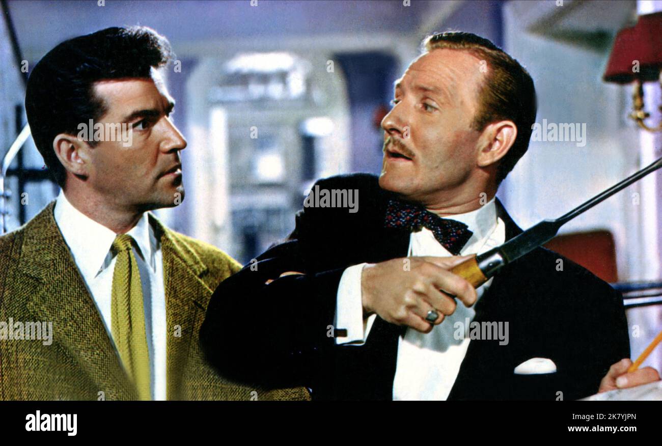 Michael Craig & Leslie Phillips Film: Doctor In Love (UK 1960) Characters: Dr. Richard Hare & Dr. Tony Burke  Director: Ralph Thomas 12 July 1960   **WARNING** This Photograph is for editorial use only and is the copyright of THE RANK ORGANISATION and/or the Photographer assigned by the Film or Production Company and can only be reproduced by publications in conjunction with the promotion of the above Film. A Mandatory Credit To THE RANK ORGANISATION is required. The Photographer should also be credited when known. No commercial use can be granted without written authority from the Film Compan Stock Photo