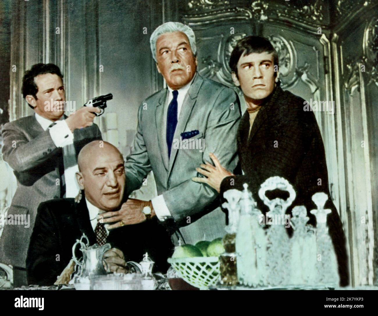 Warren Oates, Telly Savalas, Cesar Romero & Nick Henson Film: Crooks And Coronets (UK 1969) Characters: Marty Miller,Herbie Haseler,Nick Marco &  Director: Jim O'Connolly 02 April 1969   **WARNING** This Photograph is for editorial use only and is the copyright of HERMAN COHEN PRODUCTIONS and/or the Photographer assigned by the Film or Production Company and can only be reproduced by publications in conjunction with the promotion of the above Film. A Mandatory Credit To HERMAN COHEN PRODUCTIONS is required. The Photographer should also be credited when known. No commercial use can be granted w Stock Photo