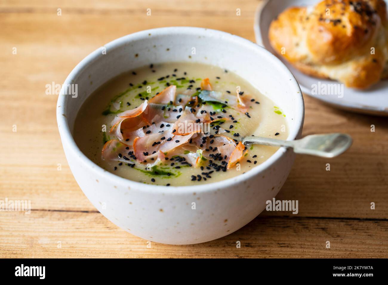 Celeriac soup with crispy parma ham and onion seeds Stock Photo
