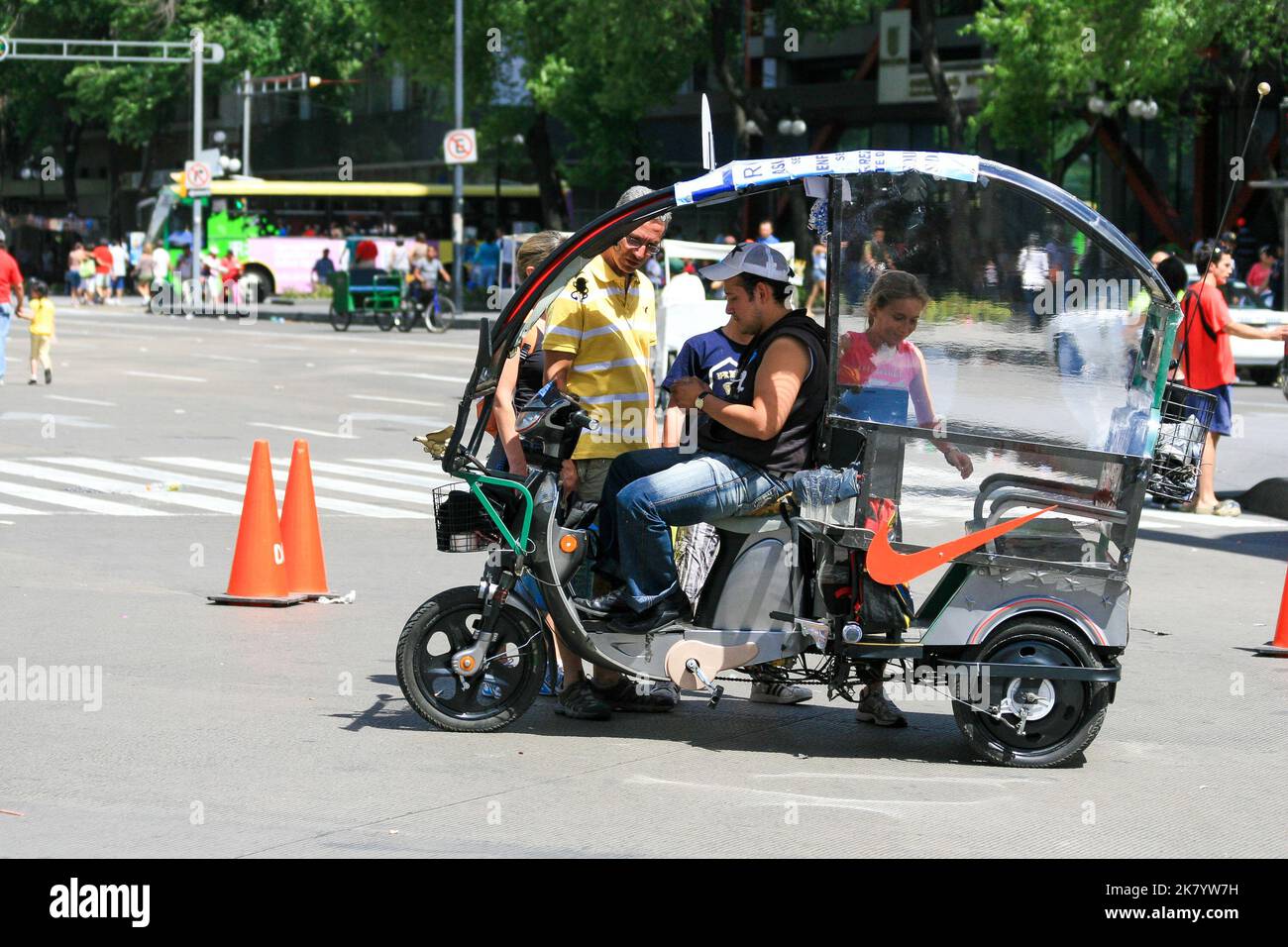 Mexico City, Mexico - 04 25 2010: A vehicle carrying people and its driver in Mexico City. Bicycle taxi Stock Photo