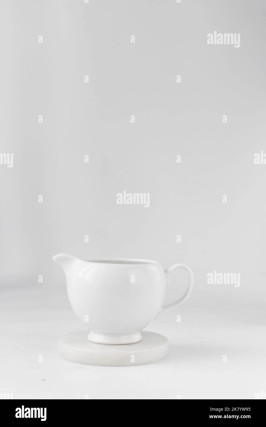 Ceramic milk jug, milk jug on a marble coaster Stock Photo Alamy