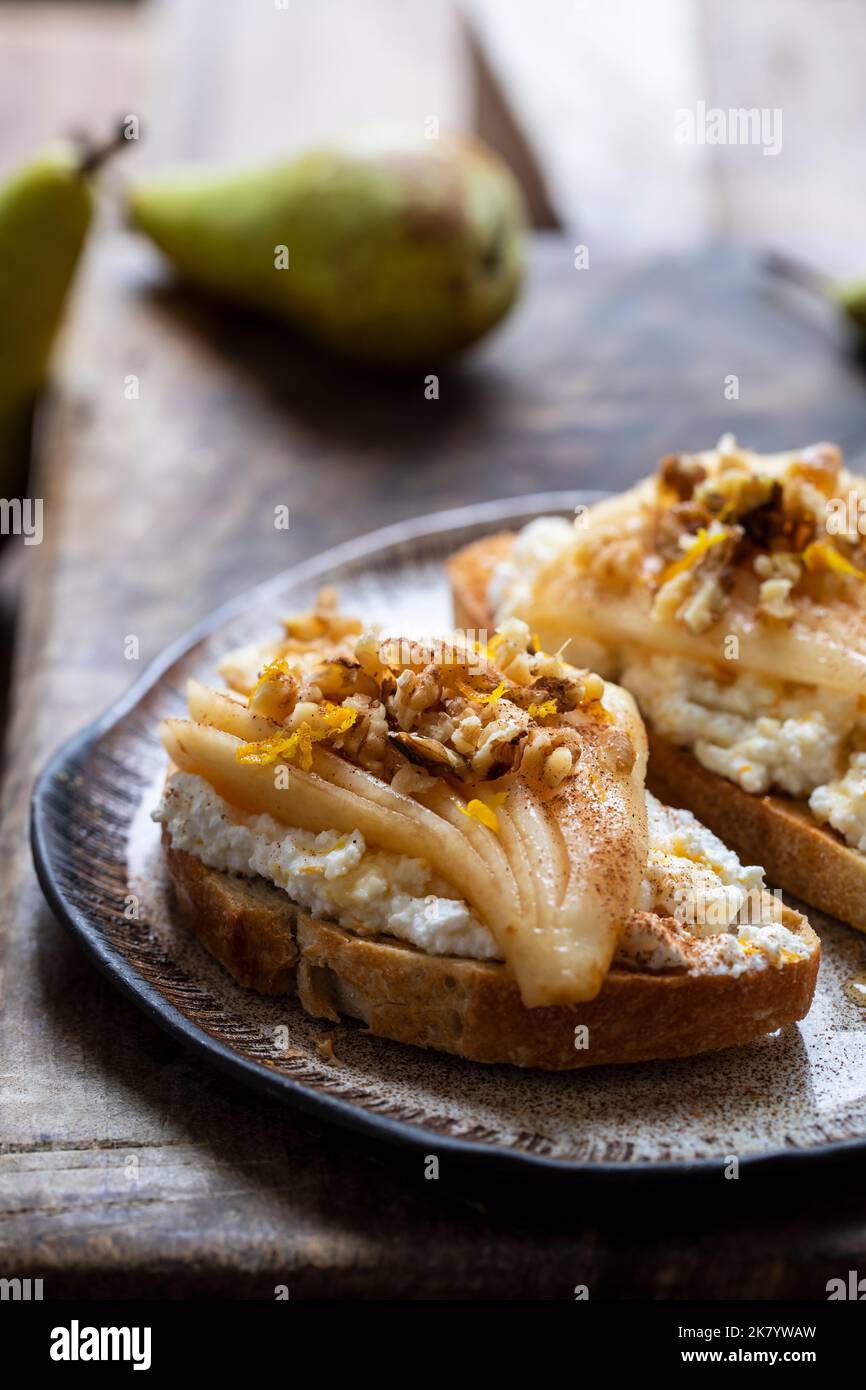 Toast with ricotta cheese, pears, walnuts and honey Stock Photo Alamy