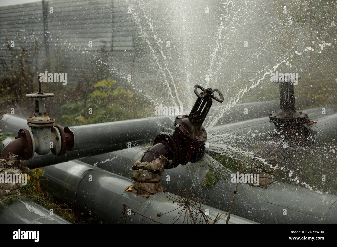 Pipe valve failure. Flow of boiling water. Steel pipe broke. Emergency