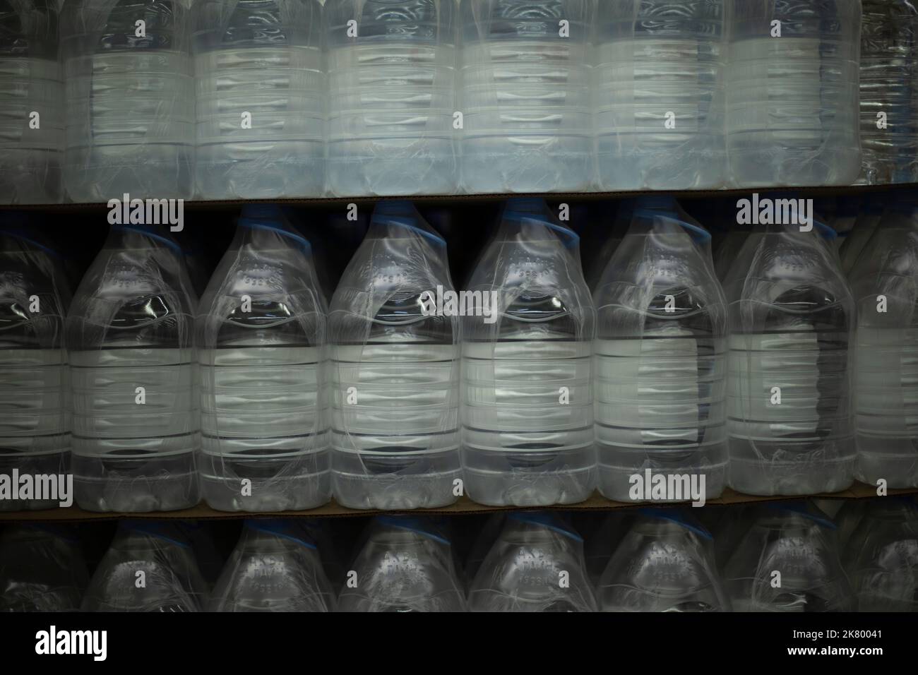 Water bottles in supermarket. Clean water in plastic bottles. Sale of