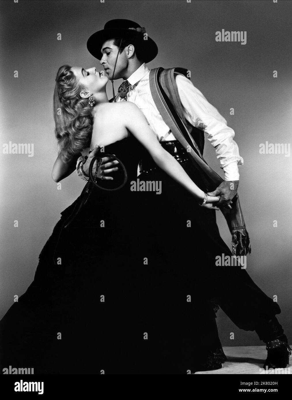 Eleanor Parker & Anthony Dexter Film: Valentino (1951) Characters: Joan Carlisle / Sarah Gray, Rudolph Valentino  Director: Lewis Allen 10 March 1951   **WARNING** This Photograph is for editorial use only and is the copyright of MGM and/or the Photographer assigned by the Film or Production Company and can only be reproduced by publications in conjunction with the promotion of the above Film. A Mandatory Credit To MGM is required. The Photographer should also be credited when known. No commercial use can be granted without written authority from the Film Company. Stock Photo