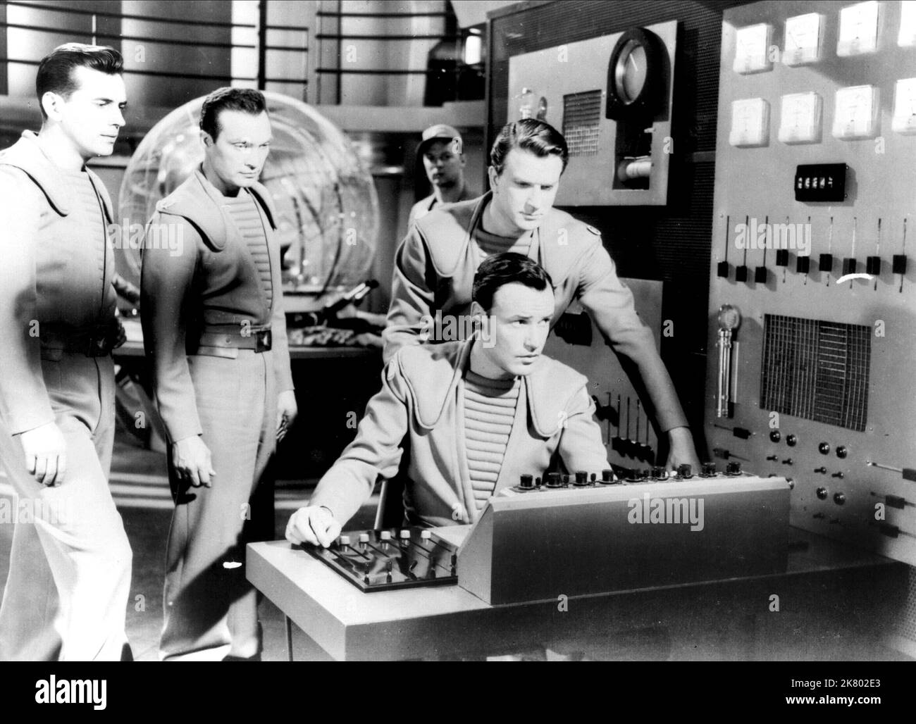 Leslie Nielsen, Jack Kelly, Warren Stevens & Richard Anderson Film: Forbidden Planet (USA 1956) Characters: Commander J. J. Adams, Lt. Jerry Farman, Lt. 'Doc' Ostrow M.D., Chief Quinn  Director: Fred M.Wilcox 23 March 1956   **WARNING** This Photograph is for editorial use only and is the copyright of MGM and/or the Photographer assigned by the Film or Production Company and can only be reproduced by publications in conjunction with the promotion of the above Film. A Mandatory Credit To MGM is required. The Photographer should also be credited when known. No commercial use can be granted witho Stock Photo