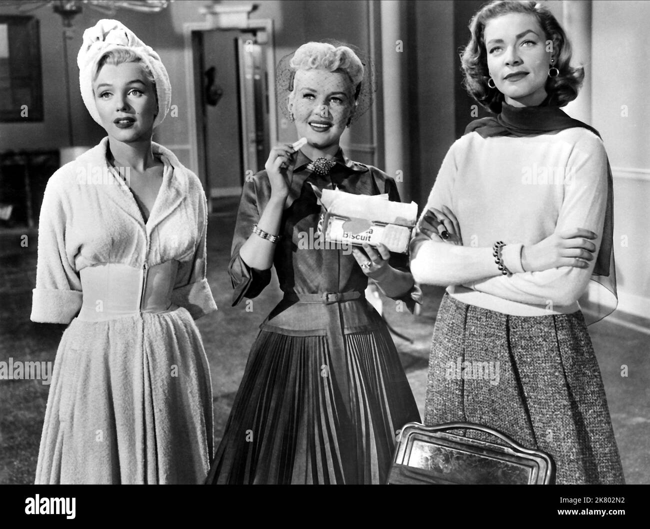 Marilyn Monroe, Betty Grable & Lauren Bacall Film: How To Marry A Millionaire (USA 1953) Characters: Pola Debevoise, Loco Dempsey, Schatze Page  Director: Jean Negulesco 04 November 1953   **WARNING** This Photograph is for editorial use only and is the copyright of 20TH CENTURY FOX and/or the Photographer assigned by the Film or Production Company and can only be reproduced by publications in conjunction with the promotion of the above Film. A Mandatory Credit To 20TH CENTURY FOX is required. The Photographer should also be credited when known. No commercial use can be granted without written Stock Photo