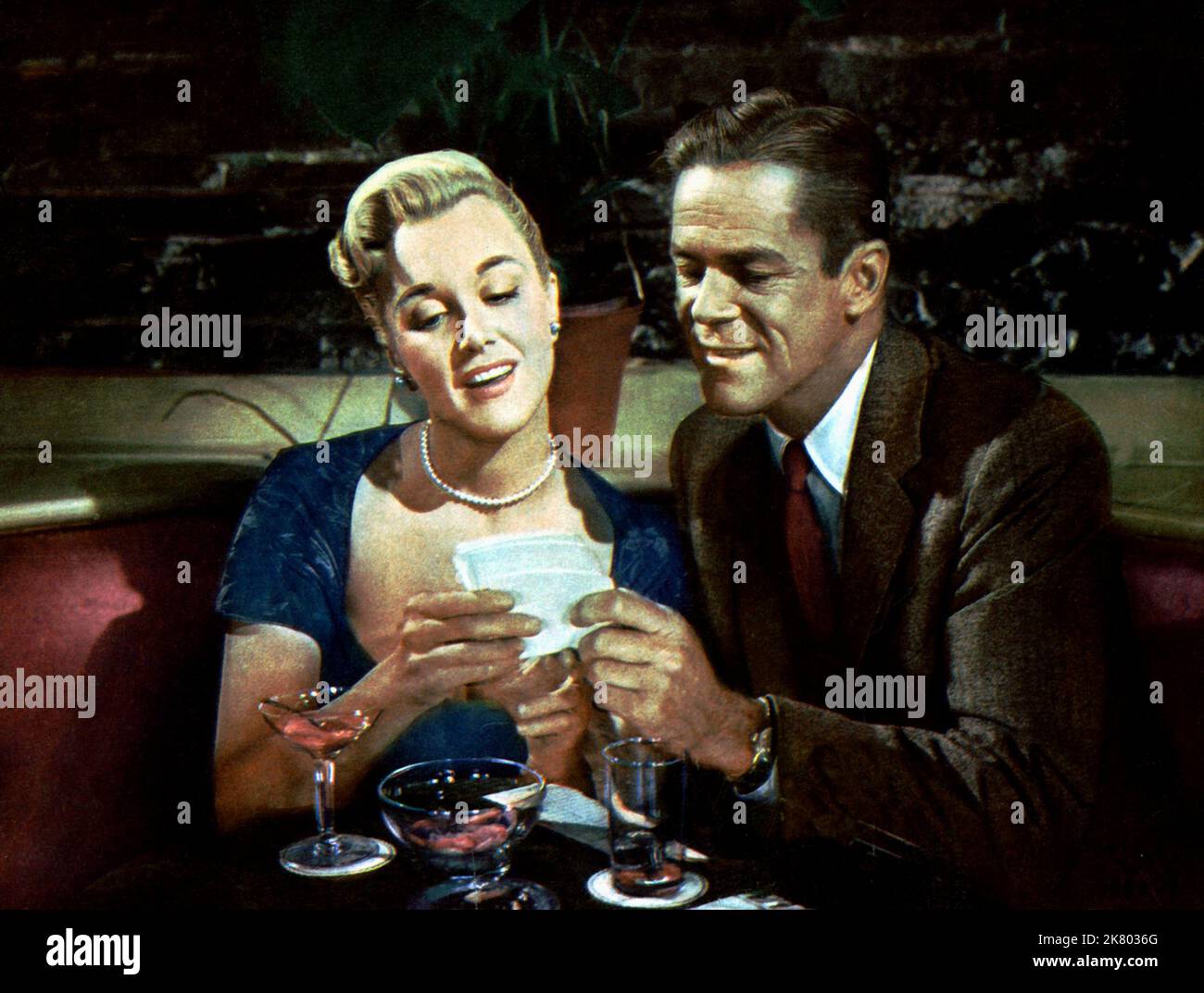 Jan Sterling & Dan Duryea Film: Kathy O' (1957) Characters: Celeste Saunders & Harry Johnson  Director: Jack Sher 24 September 1958   **WARNING** This Photograph is for editorial use only and is the copyright of UNIVERSAL and/or the Photographer assigned by the Film or Production Company and can only be reproduced by publications in conjunction with the promotion of the above Film. A Mandatory Credit To UNIVERSAL is required. The Photographer should also be credited when known. No commercial use can be granted without written authority from the Film Company. Stock Photo